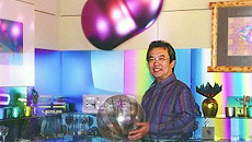 Takuji Horie with his various colorful titanium products